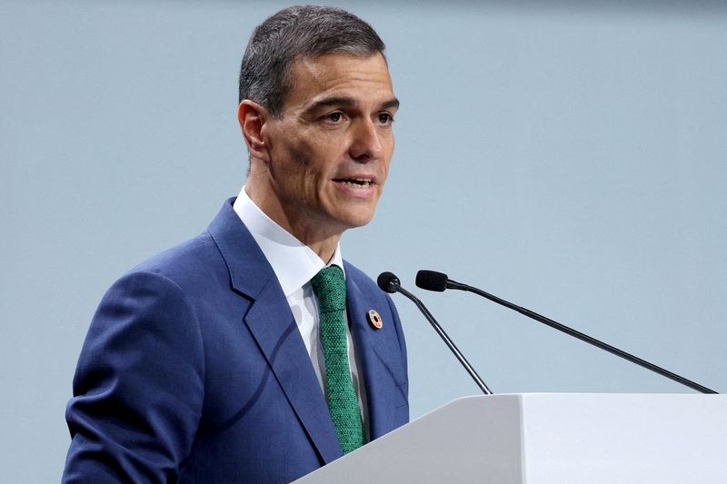 Spanish PM's Socialist party slips in poll as graft scandal takes toll