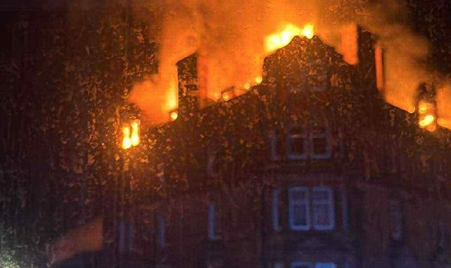 Man dies and girl, 8, in hospital after fire at four-storey building in Scotland