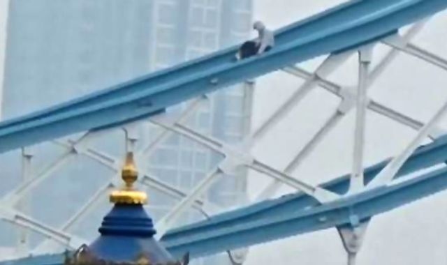 Tower Bridge shut down after man scales railings