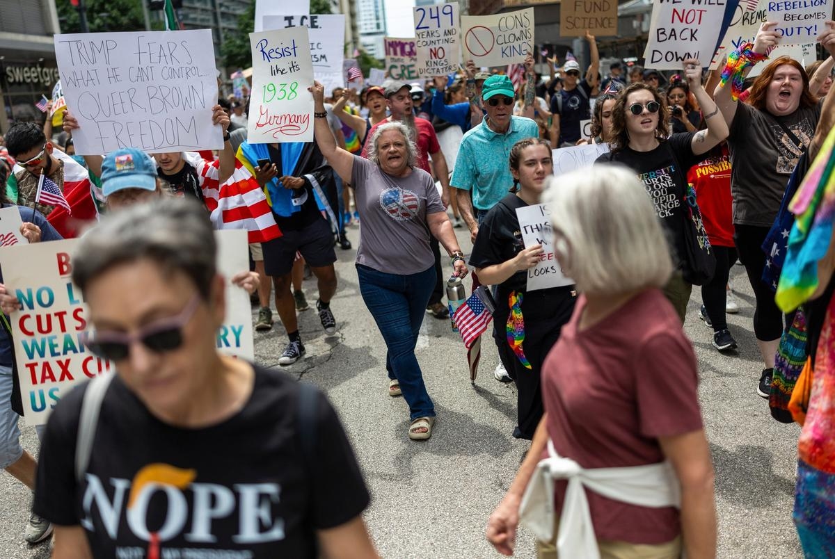 As Trump celebrates military, Texans protest president's aggressive immigration enforcement
