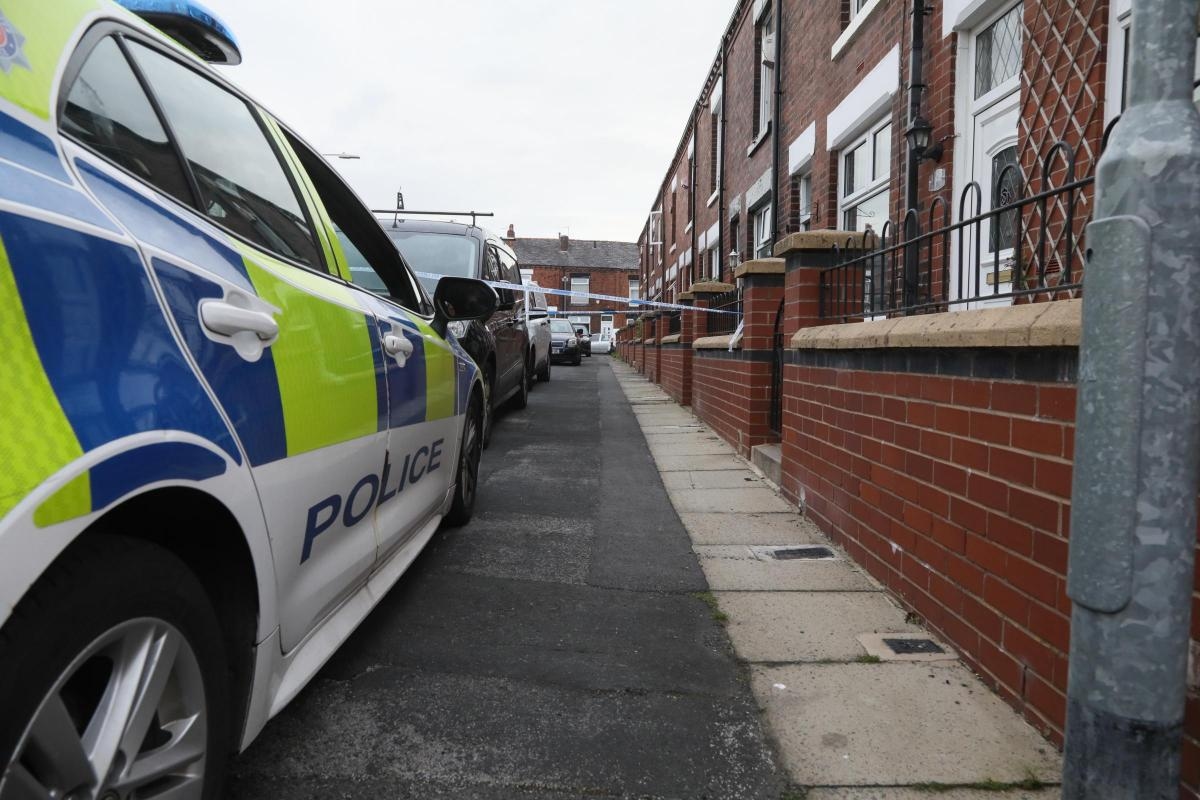 Police cordons remain in place as investigation into death continues