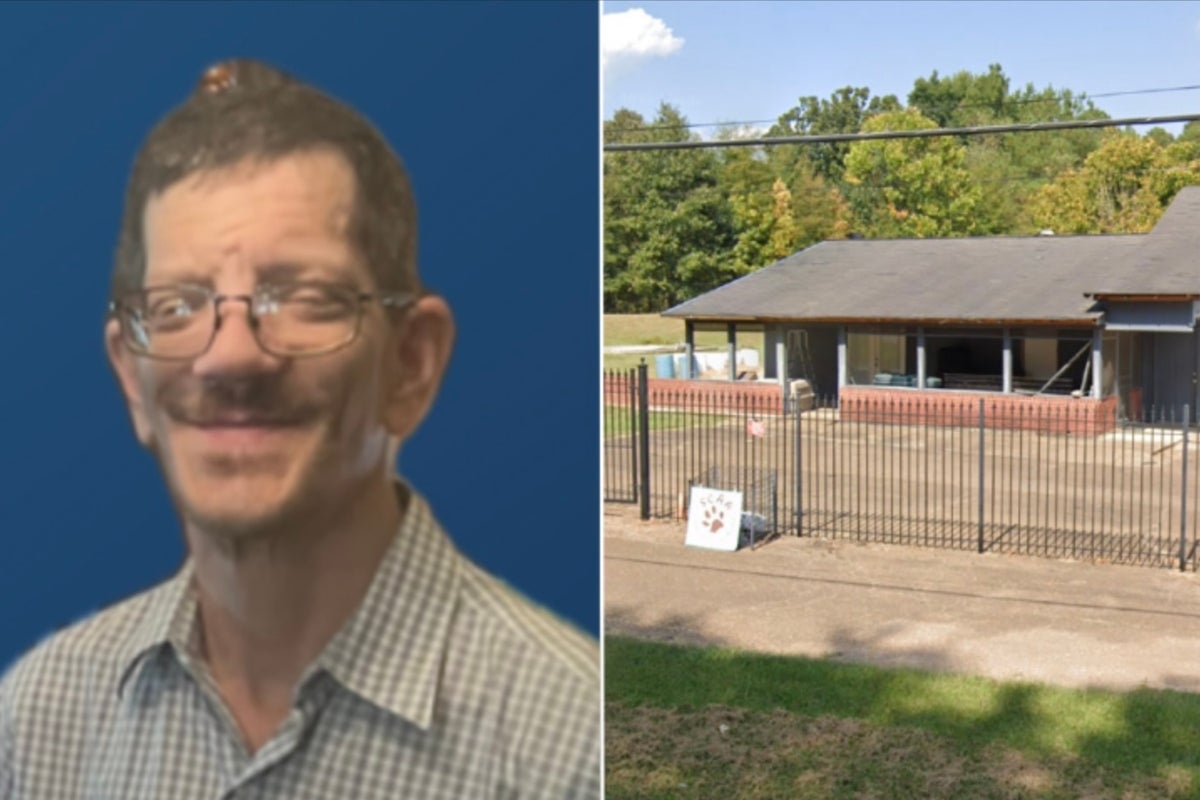 Shelter worker is mauled to death by two dogs rescued from abuse and fighting ring