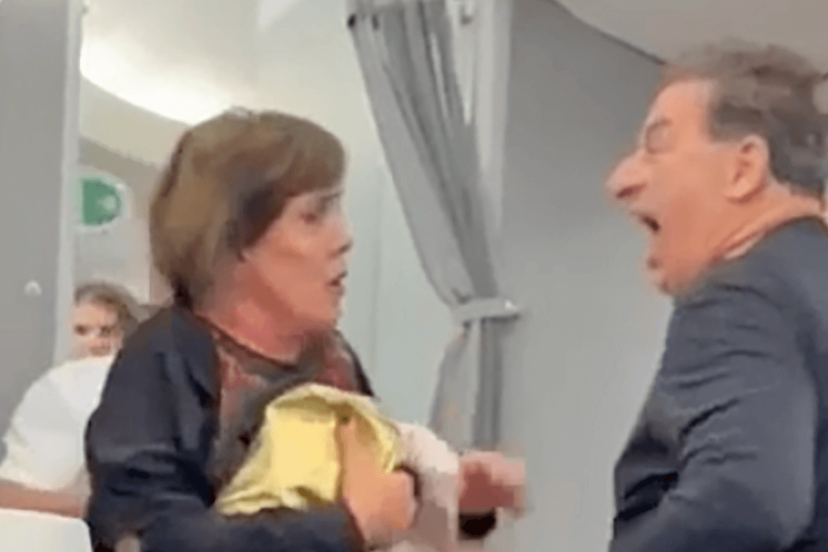 Chaos in American Airlines business class as passenger is thrown to the floor by flight attendant she then threatens to ‘kick in the balls'