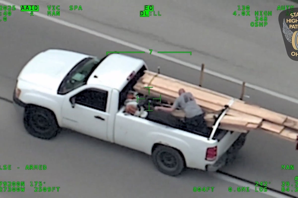 Wild police chase as man in back of pick-up hurls wooden boards at cops before multi-car wrong way crash on highway