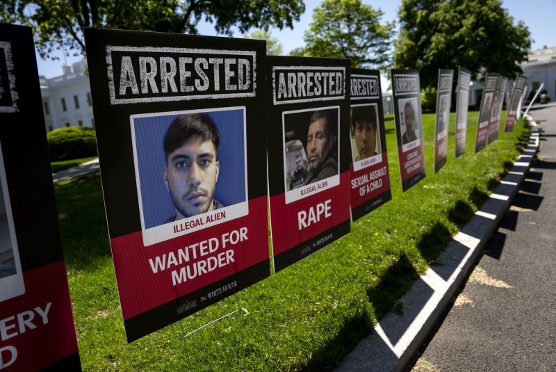 White House displays scores of what it says are mugshots of arrested immigrants