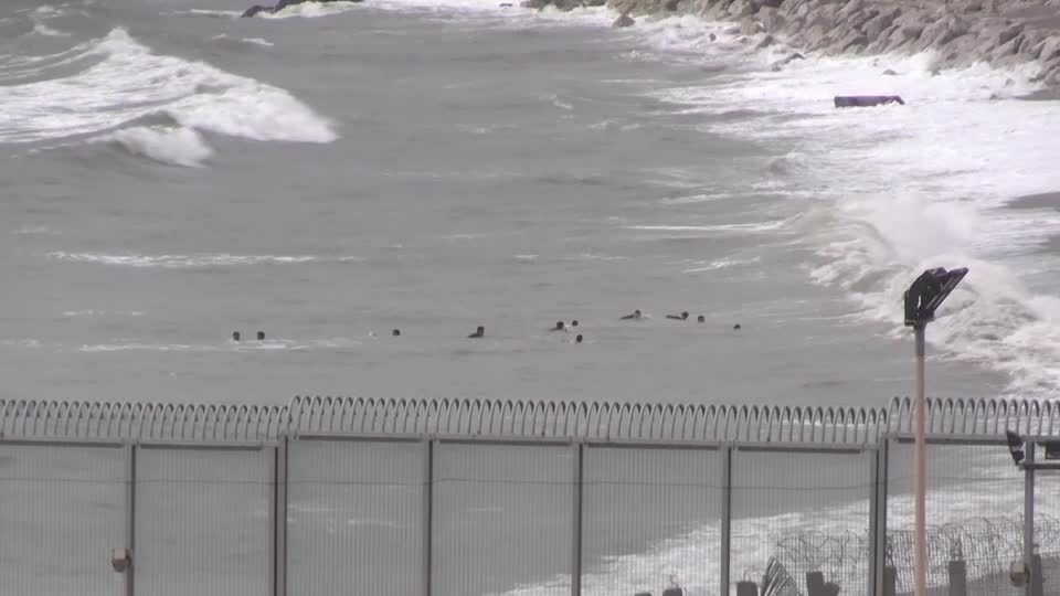 Children among migrants swimming from Morocco to Spanish enclave