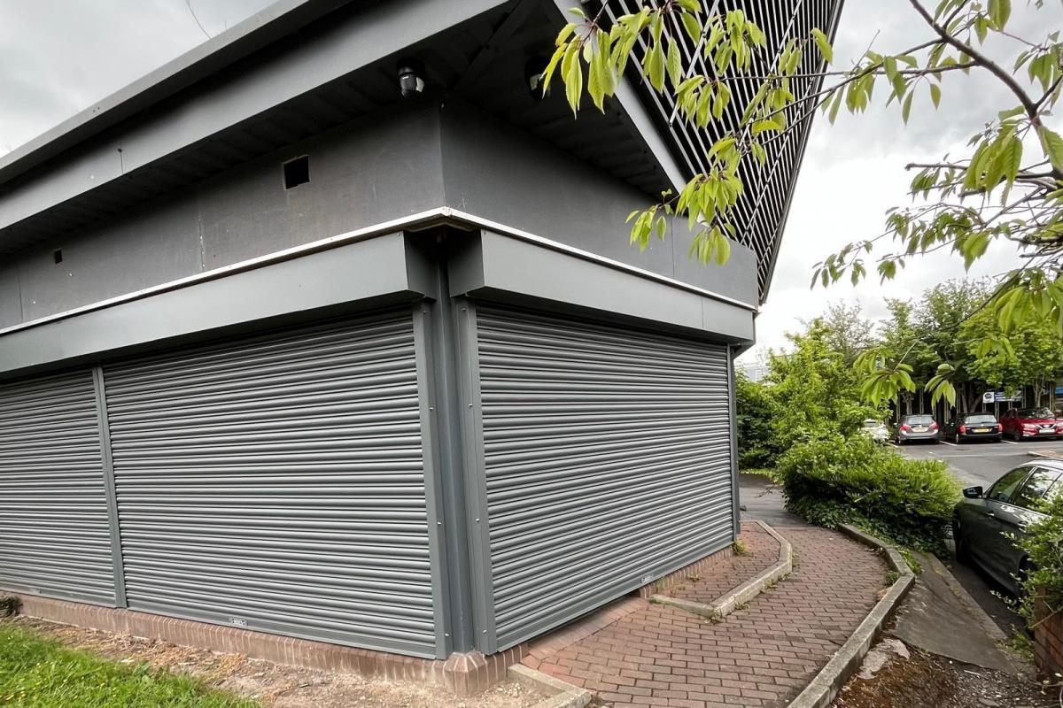 Signs removed at family business pizza takeaway as building listed for sale