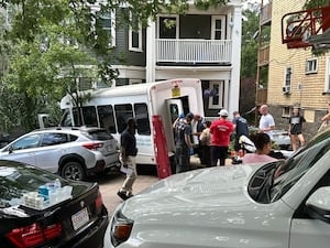 14 people taken to hospital after van crashes into Boston home