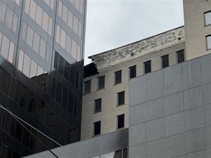 Facade of downtown high-rise building crumbling, fire department investigating