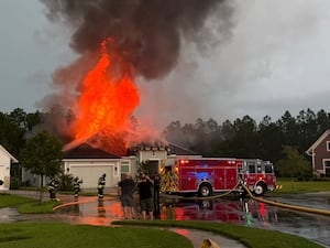 St. Johns County firefighters respond to house fire that was possibly caused by lightning strike