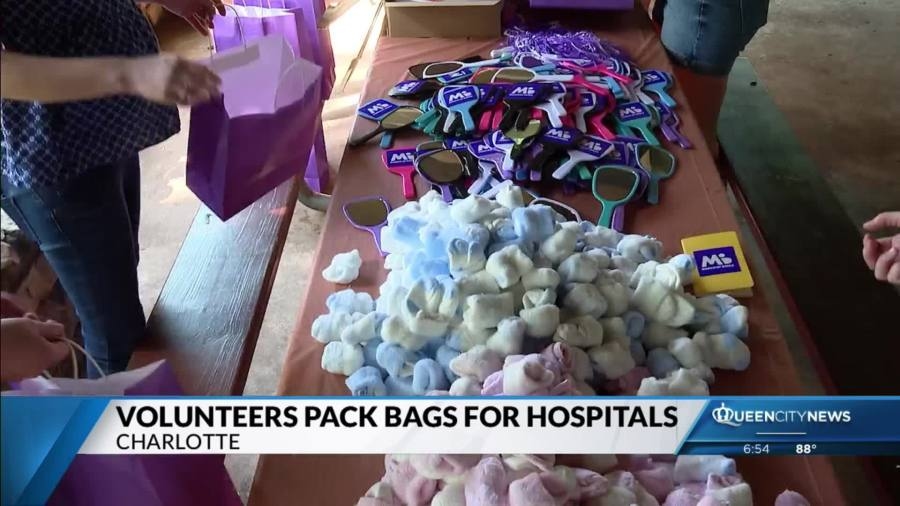 Volunteers pack bags for hospitals at Charlotte March of Dimes event