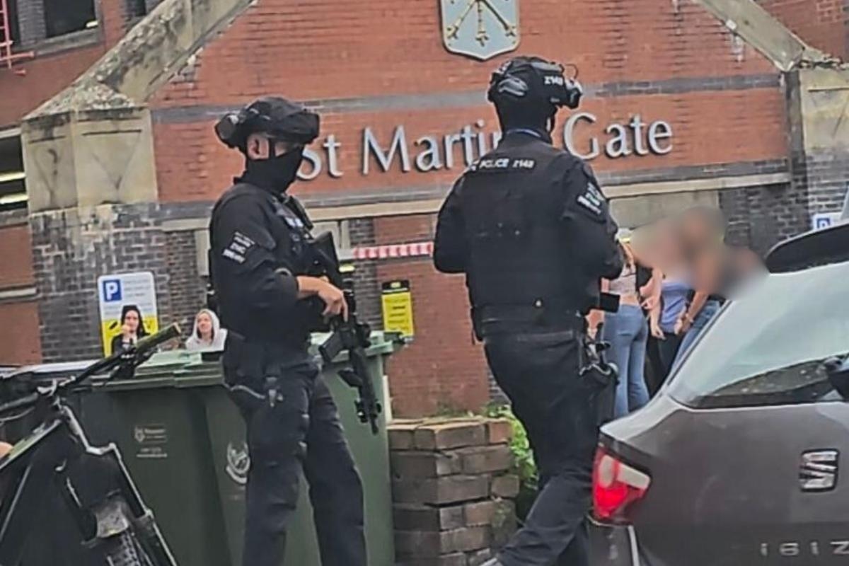 Armed police arrest three after 'threats to kill' and 'helicopter endangered'