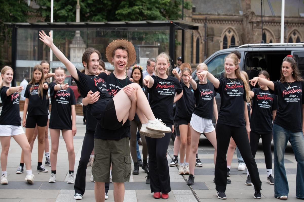 Young performers entertain city crowds ahead of musical