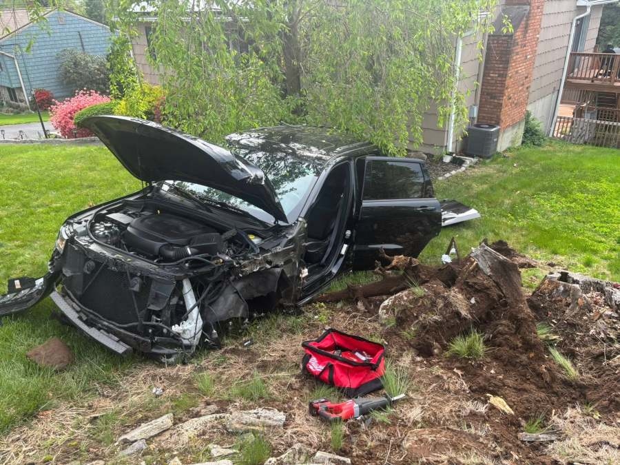Ansonia FD removes person from vehicle after crash into pole