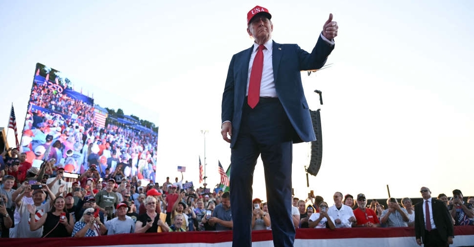 Trump celebrates tax bill victory at Iowa fairground rally