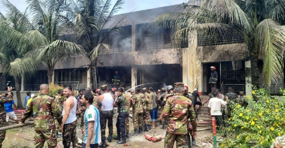 At least 19 killed as Bangladesh air force plane crashes into school campus