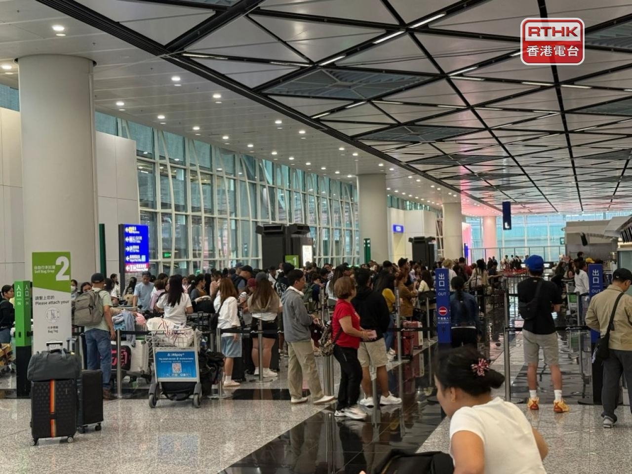 Airport operations 'back to normal' after Wipha wait