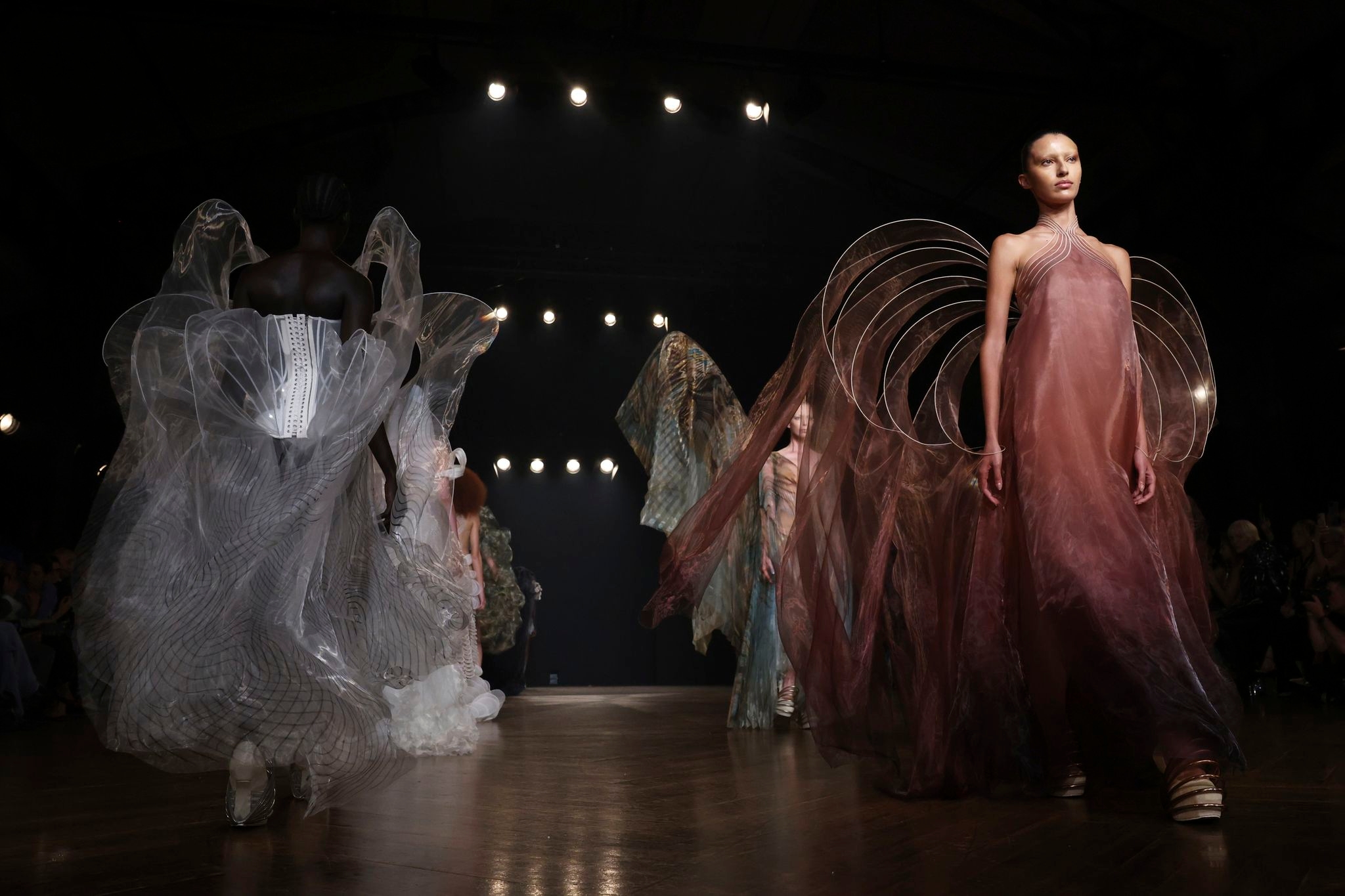 Iris Van Herpen unveils 'living' couture dress of bioluminescent algae in Paris