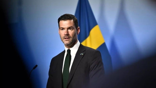 Swedish migration minister ‘shocked and horrified' by teenage son's far-right links