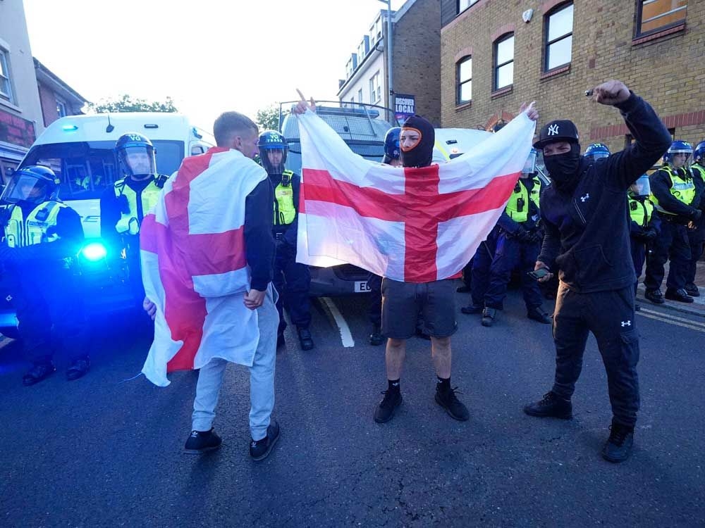 U.K. police arrest 6 after protesters descend on a hotel housing asylum seekers