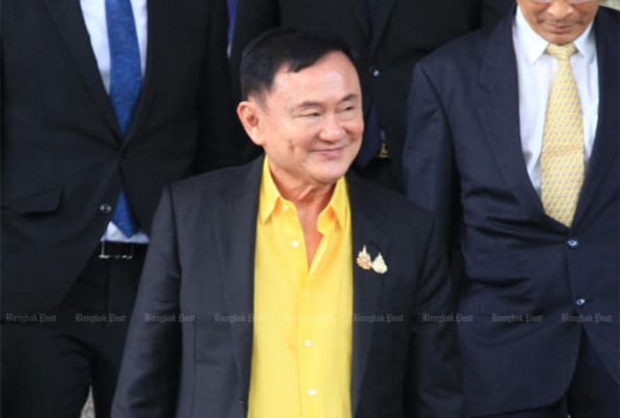 Thaksin attends Criminal Court for lese-majeste hearing