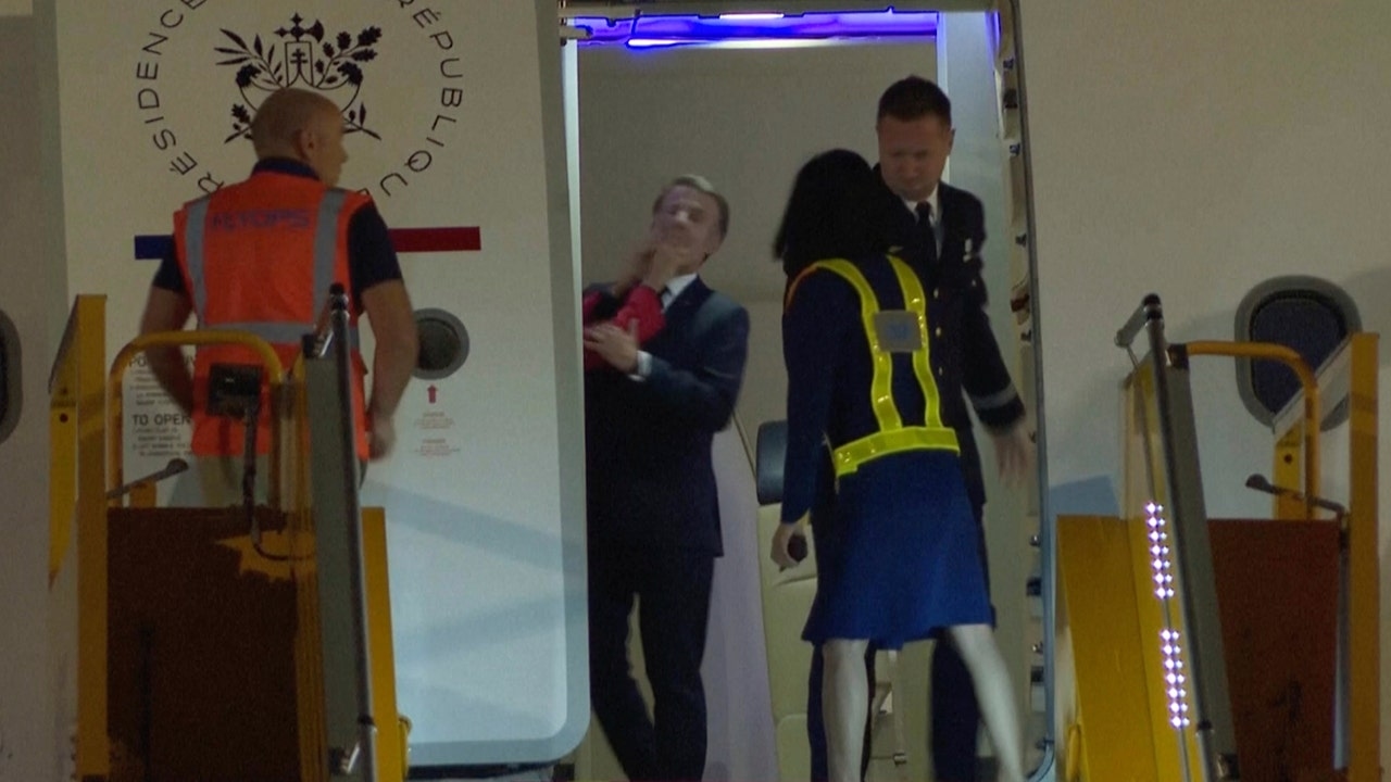 Emmanuel Macron's wife seen shoving him in the face in viral clip as France's first couple arrives in Vietnam