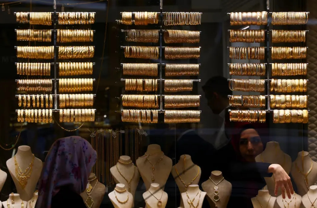 Gold Eases on Firmer Dollar, Solid US Data