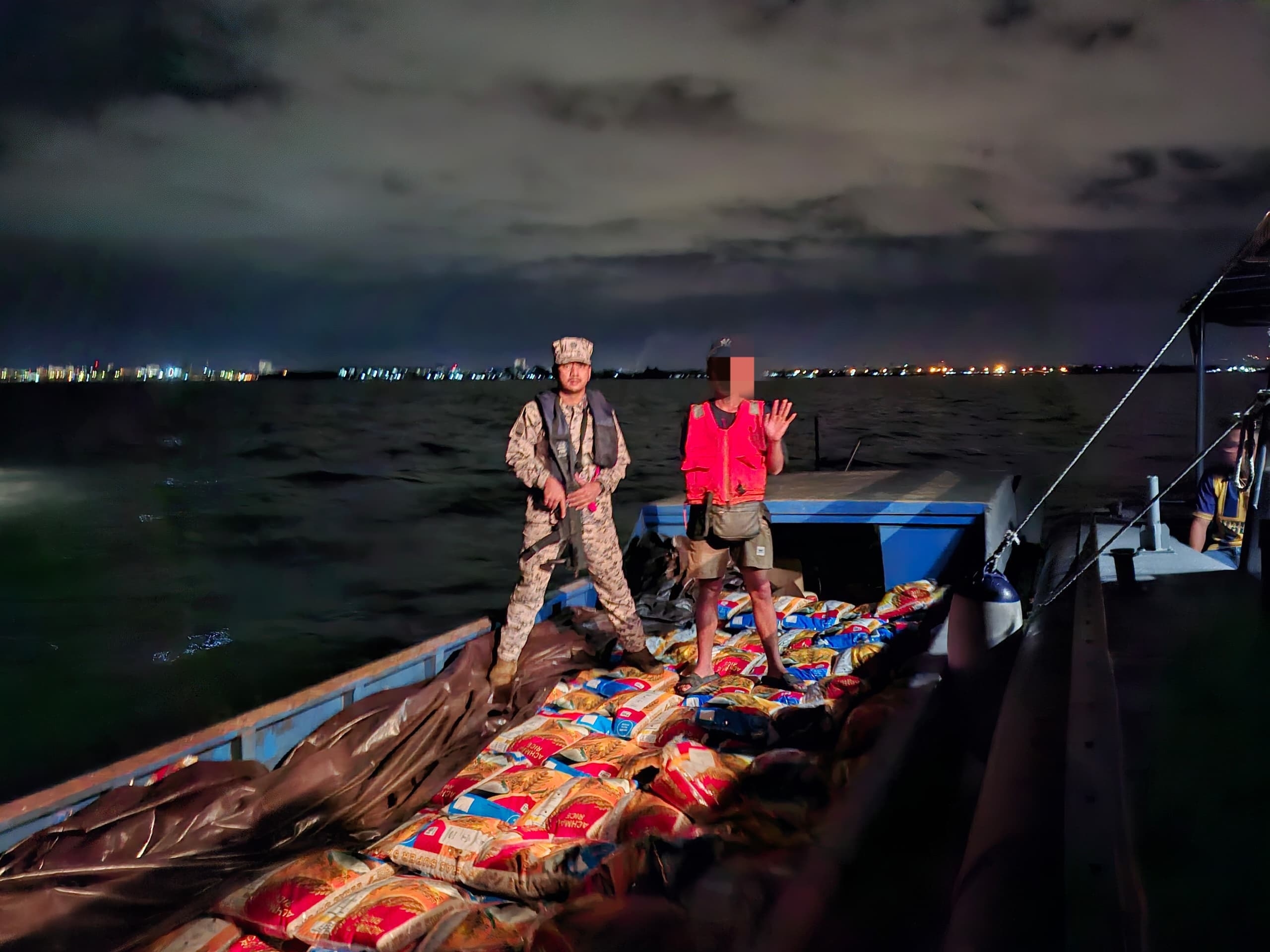 Skipper, assistant held for carrying rice, cooking oil
