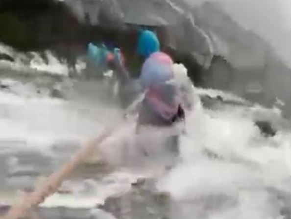 Mountain guides help 155 climbers through Mount Kinabalu waters