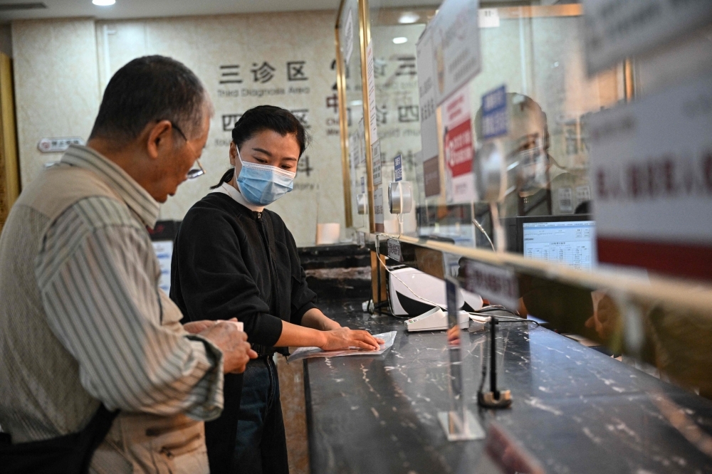 ‘Companions' ease pain of China's bustling, bamboozling hospitals