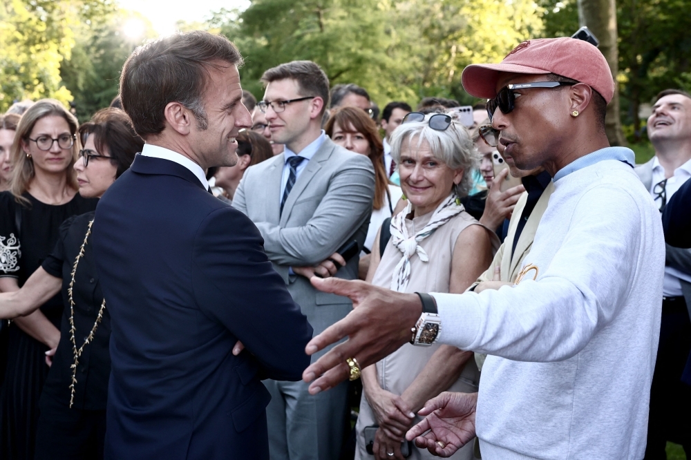 Pharrell bigs up brown denim as Paris fashion week starts