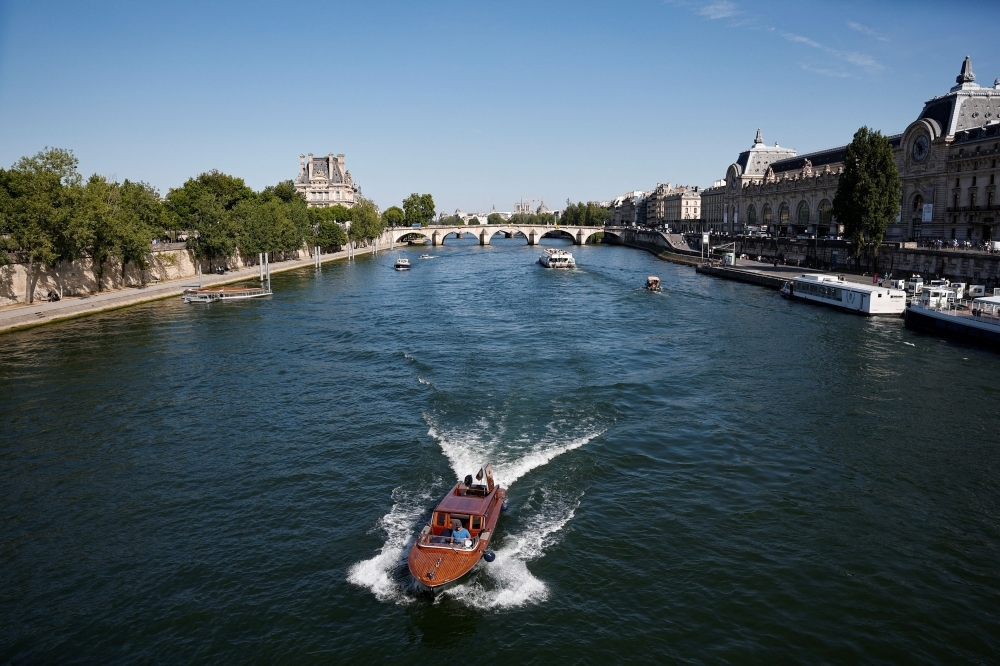 France bans smoking on beaches, parks and near schools to protect kids from passive smoke; excludes cafe terraces