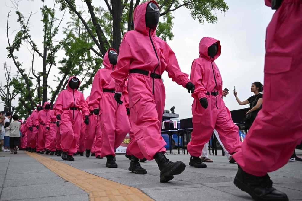 Masked marchers and giant dolls: ‘Squid Game' finale sparks fan parade in Seoul as global hit ends