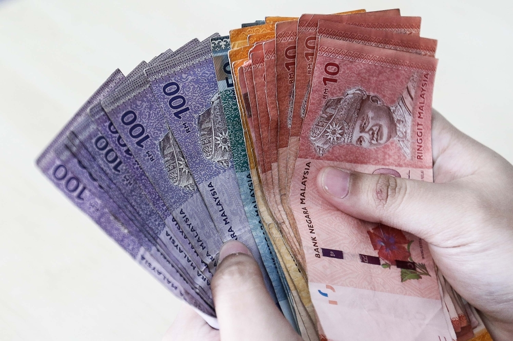 Johor woman claims she was robbed, but cops find she spent employer's RM21,000 on herself