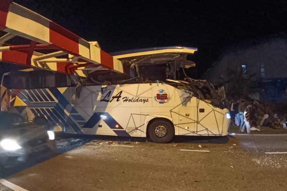 Kajang police: Express bus driver distracted while using Waze, unaware of Nilai height barrier before crashing into it