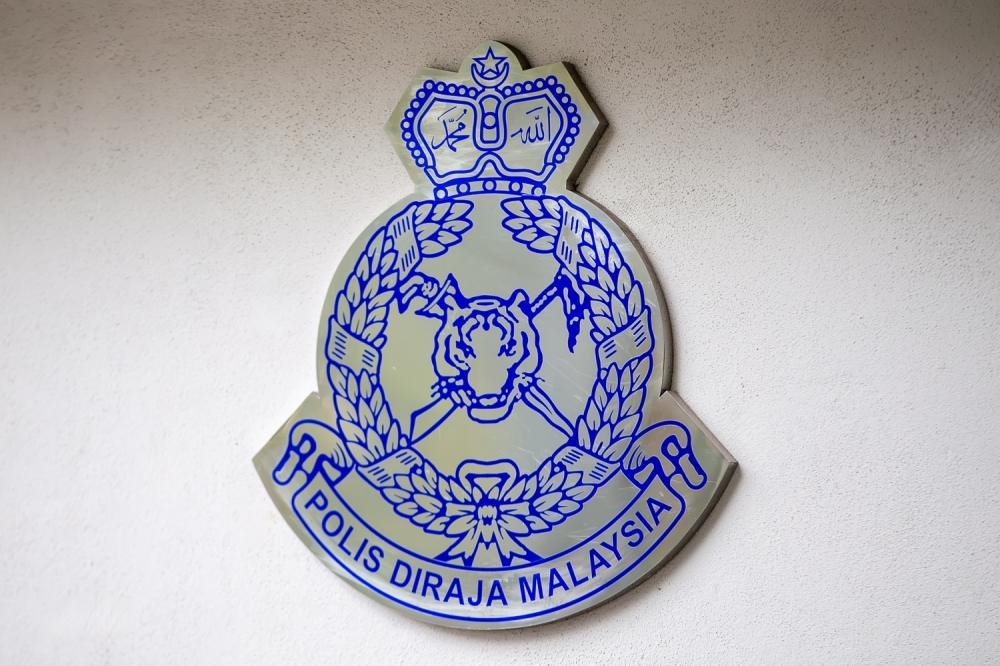 Caught on camera: Police hunt George Town man who smashed car with metal rod