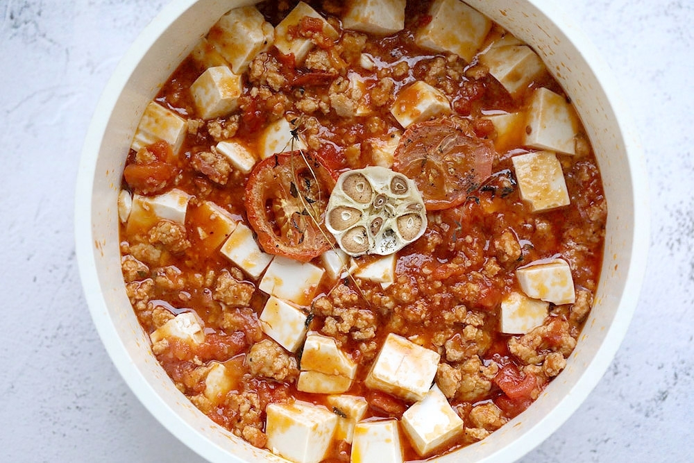 Savour Sichuan meets Seoul with this ‘gochujang mapo tofu' with roasted tomatoes and garlic