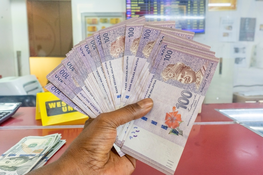 Ringgit slips against US dollar as traders await clarity on possible Malaysia-US tariff deal
