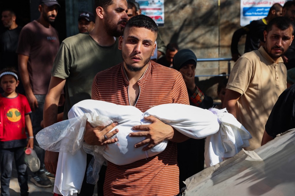Israeli strike kills one, wounds dozens as Palestinians wait for aid in Gaza