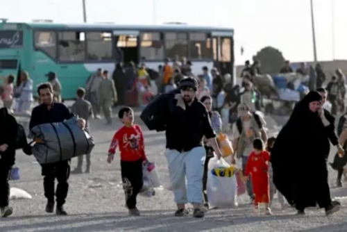 Afghans return from Iran surge ahead of deadline