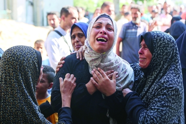 Israeli forces kill at least 12 in Gaza amid renewed truce talks