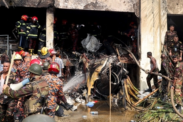 At least 19 killed as Bangladesh air force plane crashes into college campus