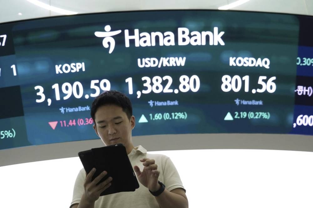 Asian shares mixed after Nvidia nudges Nasdaq to a record