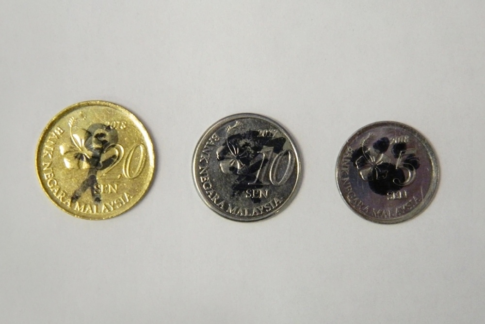 CIA spotlights Malaysian coins found at spy statue